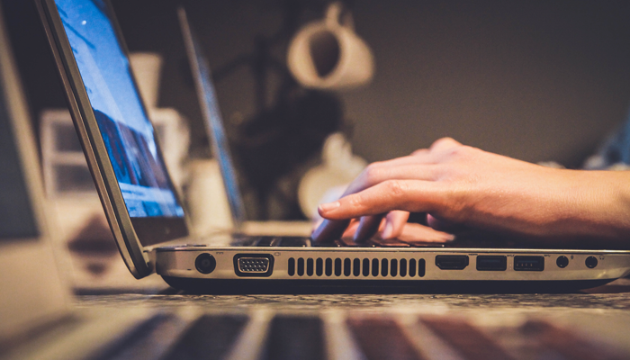 laptop with hands